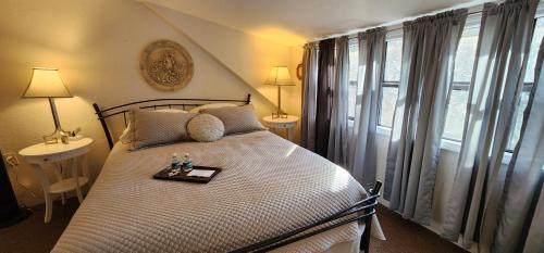 a bedroom with a bed with a tray on it at Lily Creek Lodge in Dahlonega