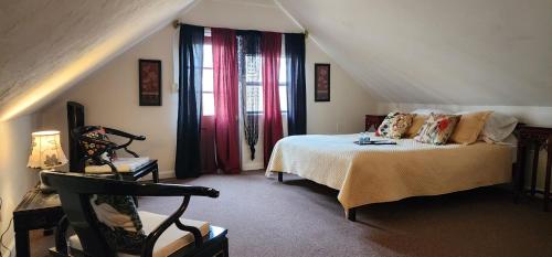 a bedroom with a bed and a large window at Lily Creek Lodge in Dahlonega
