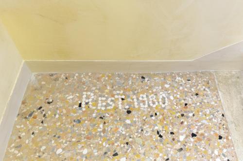 a bathroom with a floor covered in confetti at Villa Luccon - Mirano Centro Storico in Mirano
