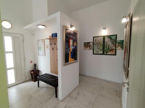 a hallway with a black bench in a room at The Forest House Krk 2 in Kras