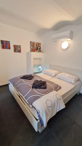 a bedroom with a large bed in a room at Valant Apartment ID I00070 in Bled