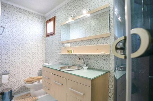 a bathroom with a sink and a toilet at Palm Splendor - Marrakech in Marrakesh