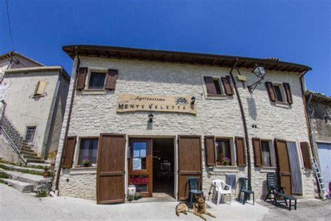 a building with a sign on the front of it at Agriturismo Monte Veletta in Castelluccio