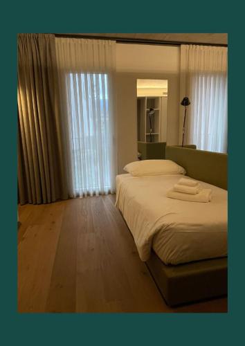 Ένα ή περισσότερα κρεβάτια σε δωμάτιο στο Hotel Giardino Verdi
