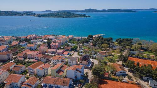 an aerial view of a town next to the water at Apartments Lovrić in Vodice
