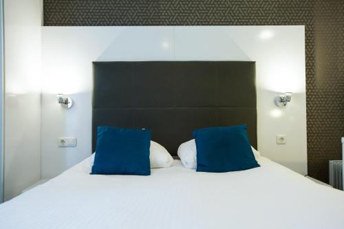 Cama o camas de una habitación en Hotel Vossius Vondelpark