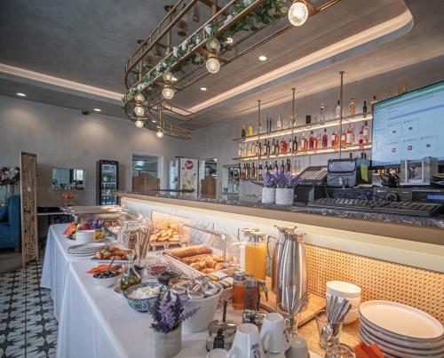 a buffet line with food on a table in a restaurant at Αρχοντικό Πορταριάς in Portaria