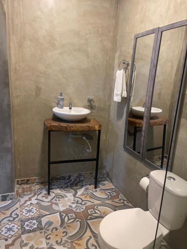 a bathroom with a sink and a toilet at Abel Boutique House in Cartagena de Indias