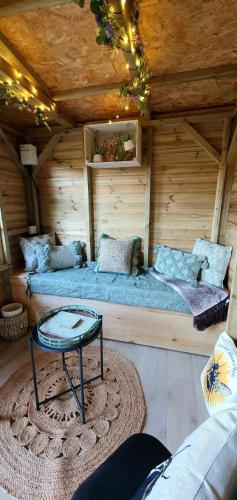 a room with two beds in a wooden house at Beatrice Cottage in Richmond