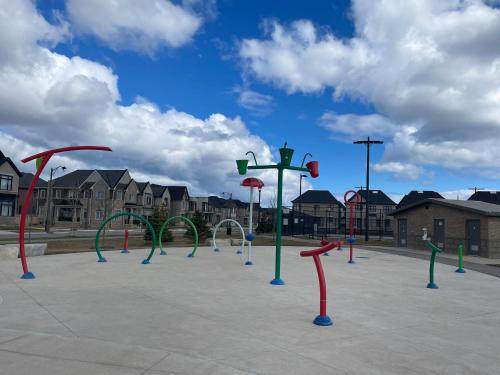 a playground with a bunch of different colored play equipment at Luxury Executive Studio in Oakville