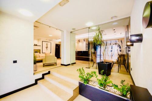 a hallway with a living room and a living room at Hotel Sun Loznica in Loznica