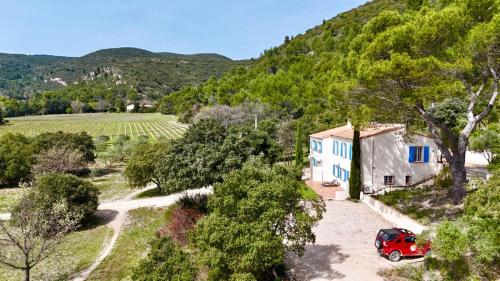 an aerial view of a house with a red car parked next to it at Mas d'Olea in Lauris
