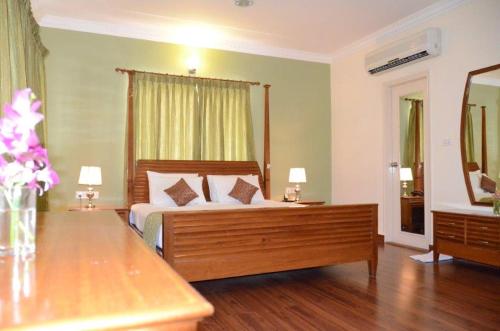 Ένα ή περισσότερα κρεβάτια σε δωμάτιο στο Trinity Suites