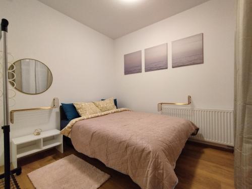 Cama o camas de una habitación en Villa Natali Warszawa