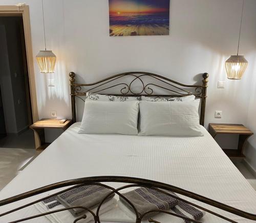 Postel nebo postele na pokoji v ubytování Ionion Seaside Home