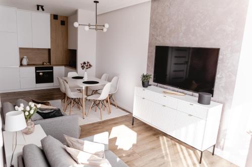 Телевизор и/или развлекательный центр в Apartament Rozmarynowa Residence 1 Opole