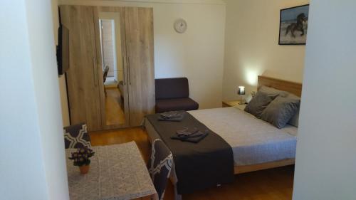 Postel nebo postele na pokoji v ubytování Apartment Uki