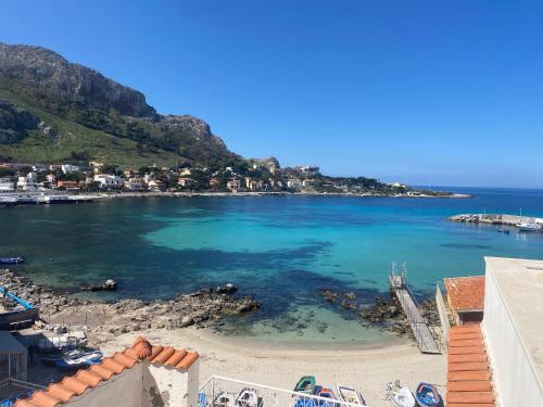 a view of a beach with blue water at Attico sul Mare - Suite & Spa in Palermo