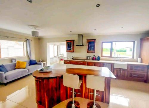 a kitchen with a large island in the middle of a room at An Ghlaise Bheag in Kilmore