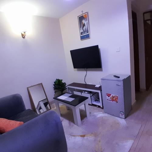 Un televizor și/sau centru de divertisment la Nectar airbnb