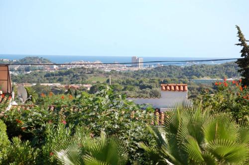 a view of a river with a bridge in the background at Villa Sotavent in Vall-Llobrega