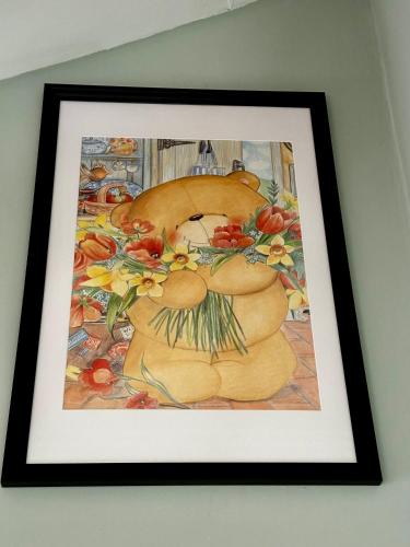 a framed picture of two donuts on a wall at Il viandante in Turin