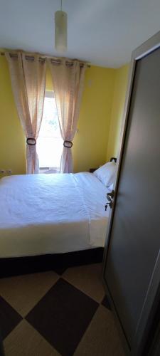 מיטה או מיטות בחדר ב-Apartmani Ad fines
