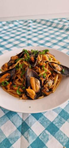 a plate of food sitting on a table at Nina's house 4 a 300 mt dal mare in Santa Caterina Dello Ionio Marina