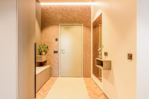 a bathroom with a walk in shower and a sink at City Panorama with SAUNA in Tartu