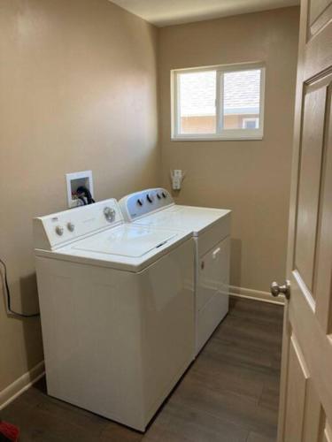 a washer and dryer in a room with a window at Helper Sunrise Peak in Helper