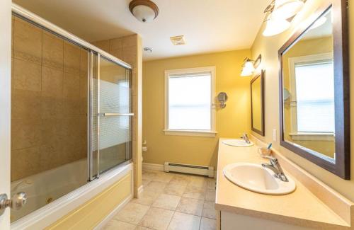 a bathroom with two sinks and a shower at Nice room D in Halifax