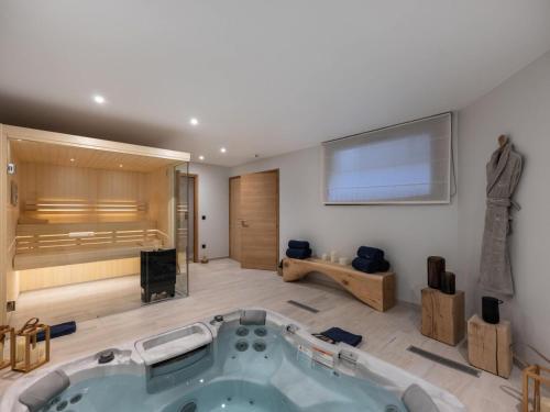 a large bathroom with a jacuzzi tub in a room at Résidence Goyard - Chalets pour 12 Personnes 184 in Courchevel