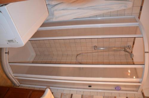 an empty shower in a bathroom with a sink at Guest House Belvedere in Tropea