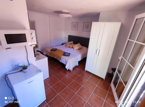 a bedroom with a bed and a tiled floor at La concha in La Laguna