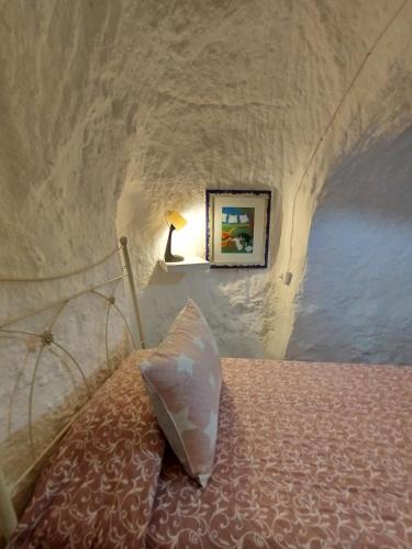 Postel nebo postele na pokoji v ubytování Cueva La Loli