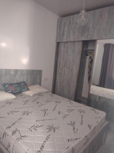 מיטה או מיטות בחדר ב-Mosti Vacational Studio