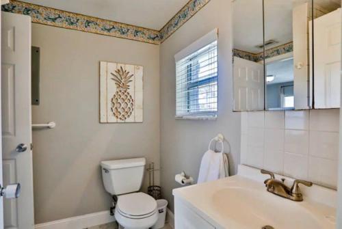 a bathroom with a toilet and a sink at Summer Sands Lodge Unit 2 in Flagler Beach