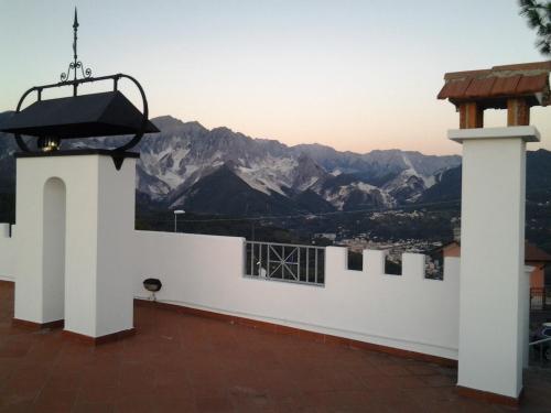 a view of the mountains from the roof of a house at Hotel Ristorante Radar in Carrara