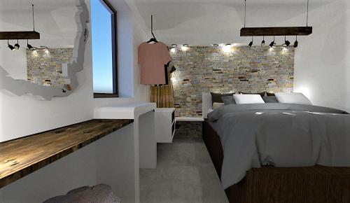 a bedroom with a bed and a brick wall at Casa Napais Luxury Private Villa in Archangelos