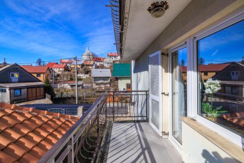 a balcony with a view of a city at Apartmani Anđelić- Fužine 1 in Fužine