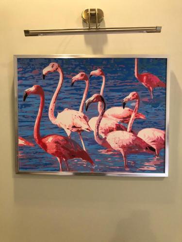a painting of pink flamingos in the water at Casa Tavera- Adults Only in Mérida