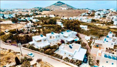 an aerial view of a town with white buildings at Villa Nausithoe 1 Paros in Logaras