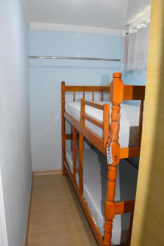 a pair of bunk beds in a room at Hostel Cascavel in Cascavel
