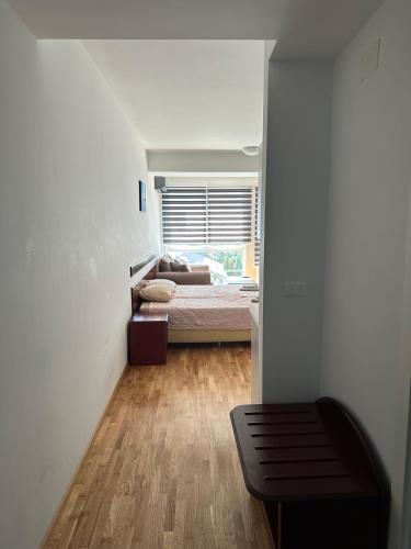 a bedroom with a bed and a window at Apartments Nora in Ohrid