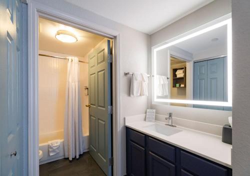 a bathroom with a sink and a mirror at Staybridge Suites Jackson, an IHG Hotel in Ridgeland