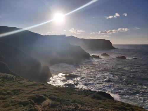 a view of the ocean with the sun in the sky at Hotel Villanueva San Jorge de Heres in Villanueva