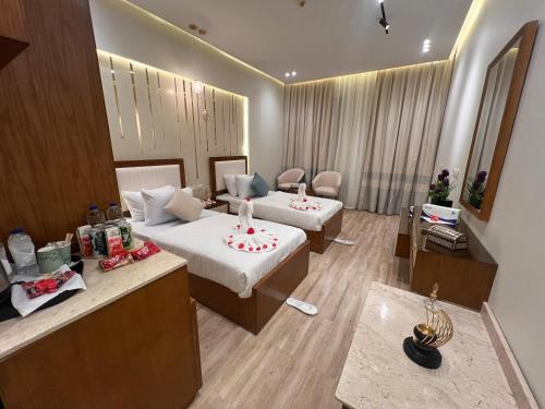 a hotel room with two beds and a mirror at Ramage Hotel & Resort in Cairo