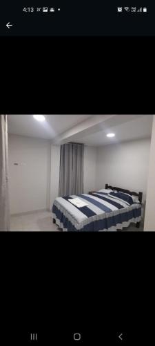Una foto de un dormitorio con dos camas. en Magu Hotel Huarmey, en Huarmey