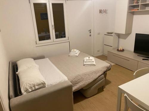 Tempat tidur dalam kamar di Appartamento In Villa