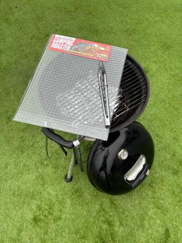 a table and a helmet sitting on the grass at Yiyi Villa Awaji 淡路島西海岸夕日百選のvilla BBQ釣りゴルフ in Awaji